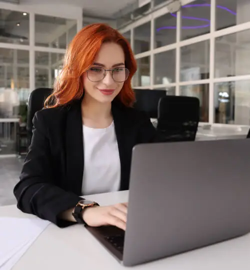 Instructor working at a laptop